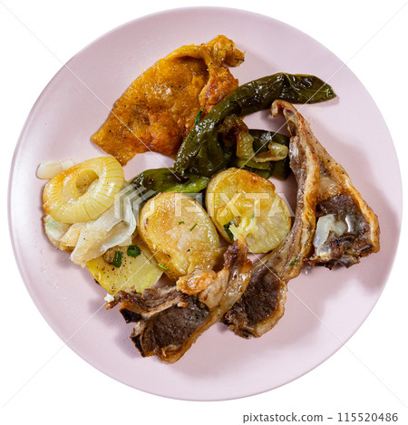 Lamb ribs served with potatoes and peppers 115520486