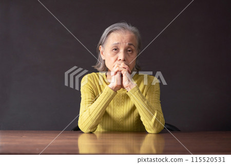 Worried senior woman Worried senior woman 115520531
