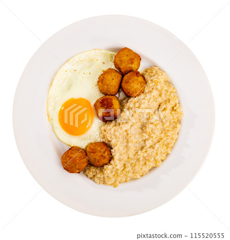 Mediterranean style meal of sunny side up egg, oatmeal and meatballs 115520555