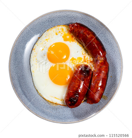 Fried egg with chorizo sausage served for breakfast 115520566