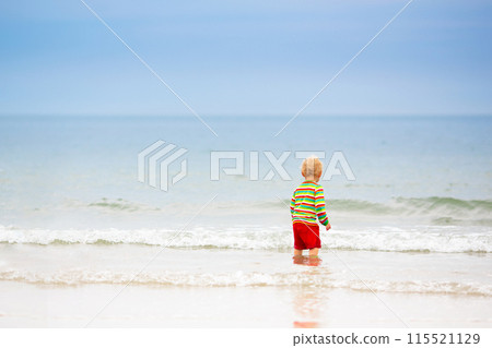 Kids playing on beach. Children play at sea. 115521129