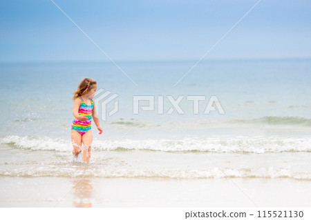 Kids playing on beach. Children play at sea. 115521130