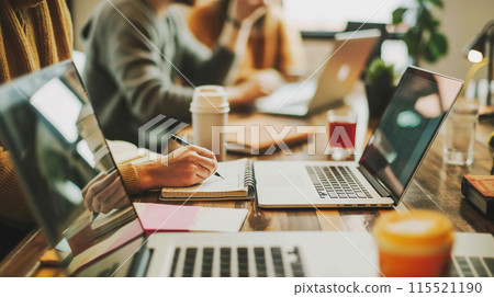 Office meeting and business people using laptops Office meeting and business people using laptops 115521190