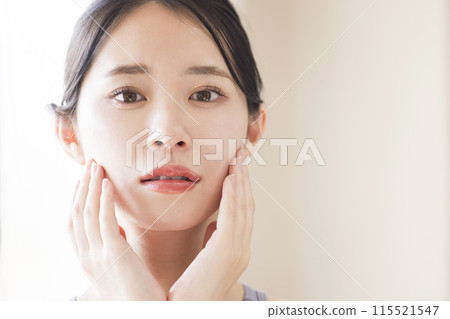 Skin care beauty image young woman touching her cheek Skin care beauty image young woman touching her cheek 115521547