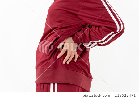 Woman in jersey, back pain, hand 115522471