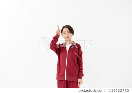 Woman in jersey pointing, hype 115522760