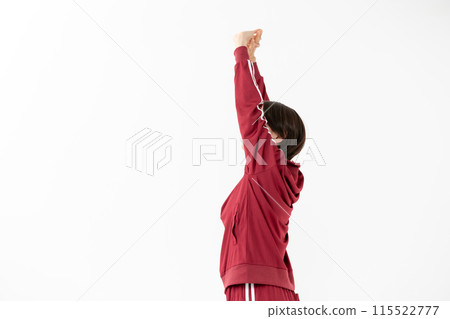 Woman in jersey stretching 115522777