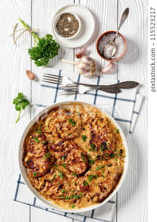 creamy smothered pork chops cooked in onion gravy creamy smothered pork chops cooked in onion gravy 115523217