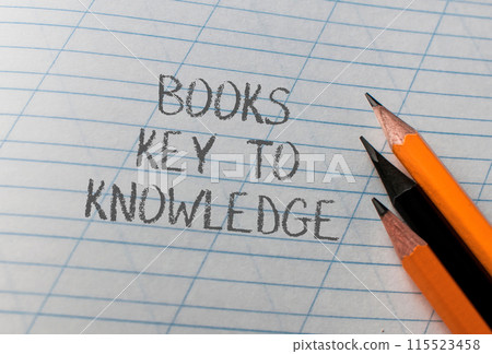 A piece of paper with the words books key to knowledge written on it A piece of paper with the words books key to knowledge written on it 115523458