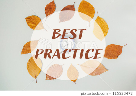 A circle of leaves with a clock in the center A circle of leaves with a clock in the center 115523472