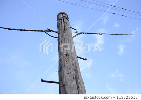 An old wooden telephone pole An old wooden telephone pole 115523615