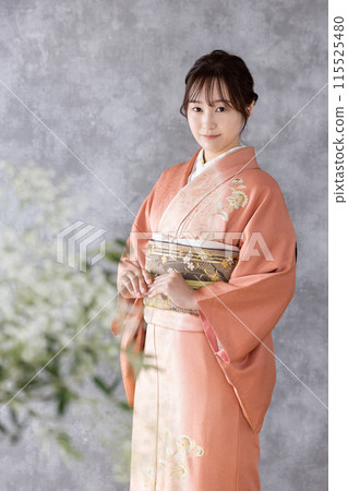 A woman wearing a formal kimono 115525480