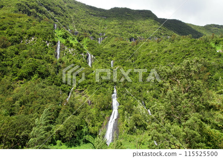 The Bride's Veil Falls flow down the cliffs of the Cirque de Salazie, a World Heritage Site located in the center of the French overseas department of Reunion Island. 115525500