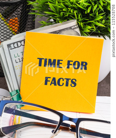 Business concept. The inscription Time for Facts on a yellow sticker on the background of money 115528708
