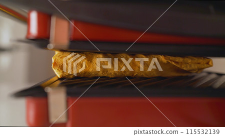 Home grill fries shawarma. shaurma, Grilled roll of pita bread with falafel, hummus, chips salad and vegetables in a frying pan. Home grill fries shawarma. shaurma, Grilled roll of pita bread with falafel, hummus, chips salad and vegetables in a frying pan. 115532139