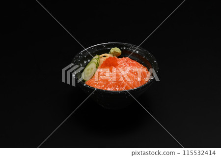 Bowl of salmon Donburi served with wasabi and prickled ginger on black background. Japanese food concept Bowl of salmon Donburi served with wasabi and prickled ginger on black background. Japanese food concept 115532414