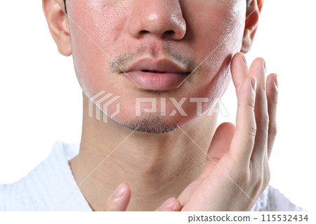 Man applying cream on face isolated on white background. Skin care and cosmetic procedures concept Man applying cream on face isolated on white background. Skin care and cosmetic procedures concept 115532434
