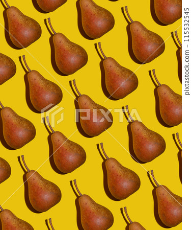 Pear pattern. Yellow and orange Bera pears on yellow background. Ripe juicy fruits. Food background. 115532545