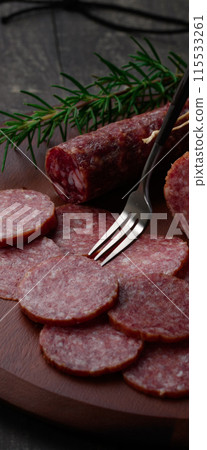 Aged salami on a cutting board Aged salami on a cutting board 115533261