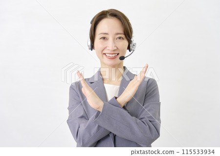 Operator making a cross gesture with his hand on a white background Operator making a cross gesture with his hand on a white background 115533934