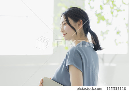 A woman with a laptop A woman with a laptop 115535118