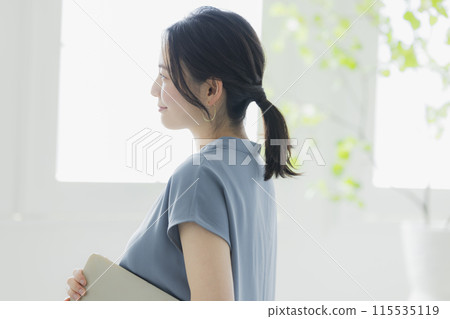 A woman with a laptop A woman with a laptop 115535119