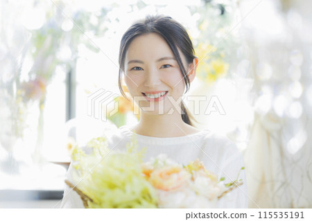 Young woman with bouquet 115535191