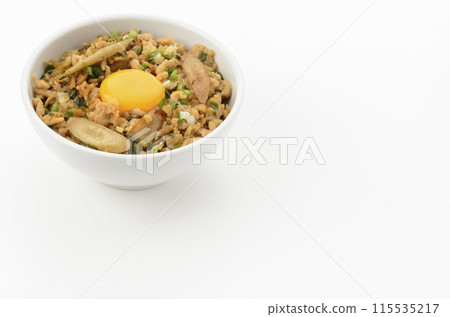 Minced chicken rice bowl with burdock and egg yolk 115535217