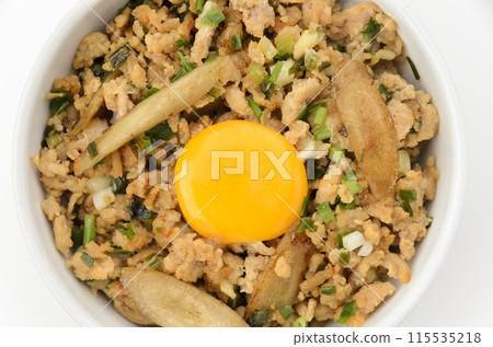 Minced chicken rice bowl with burdock and egg yolk Minced chicken rice bowl with burdock and egg yolk 115535218
