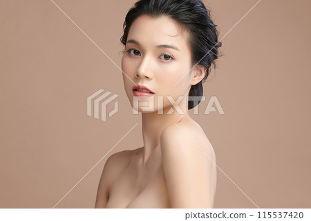 Beautiful young asian woman with clean fresh skin on beige background, Face care, Facial treatment, Cosmetology, beauty and spa, Asian women portrait. 115537420