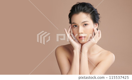 Beautiful young asian woman with clean fresh skin on beige background, Face care, Facial treatment, Cosmetology, beauty and spa, Asian women portrait. 115537425