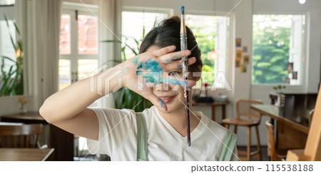 Talented Artist Painting in Bright Workshop with Natural Light and Creative Atmosphere, Showcasing Artistic Process and Inspiration in a Modern Studio Setting 115538188