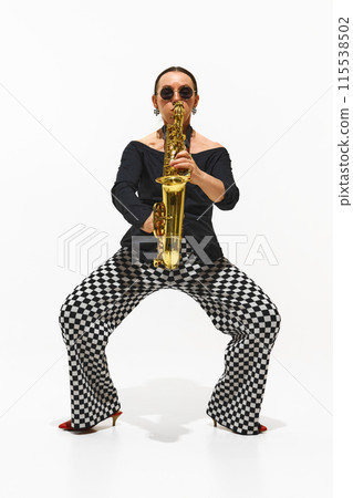 Modern Jazz Fusion. Portrait of stylish lady, musician performing solo with saxophone isolated on white background 115538502