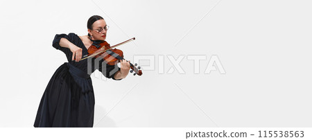 Solo Symphony. Beautiful woman i black dress, musician gracefully performs violin solo isolated on white background Solo Symphony. Beautiful woman i black dress, musician gracefully performs violin solo isolated on white background 115538563