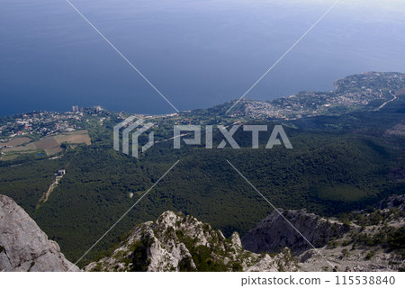 Mount Ai-petri.View from above.  View from the mountain, below is a valley flowing into the Black Sea.The blue colour of the sea from above is beautiful. 115538840