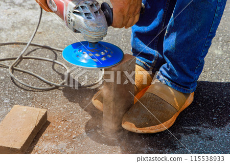 Before installing paving bricks stones, master grind them using circular diamond disc saw 115538933