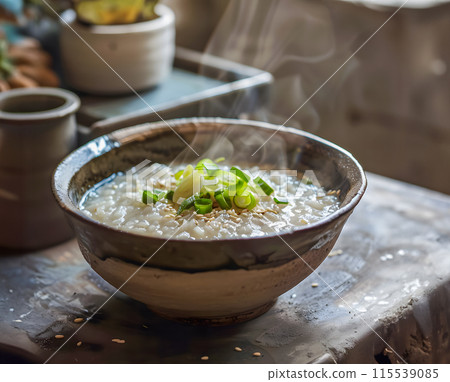 Steam of Mush or boiled rice asian style with smoke in wood bowl on dark background.1 115539085