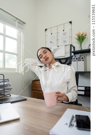 Overworked Businesswoman Experiencing Neck Pain in Modern Office Setting, Stress and Fatigue from Long Work Hours, Professional Struggle with Physical Discomfort, Workplace Wellness and Health Issues Overworked Businesswoman Experiencing Neck Pain in Modern Office Setting, Stress and Fatigue from Long Work Hours, Professional Struggle with Physical Discomfort, Workplace Wellness and Health Issues 115539681