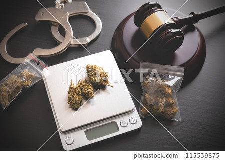 Weighing marijuana buds on a scale. Weighing marijuana buds on a scale. 115539875