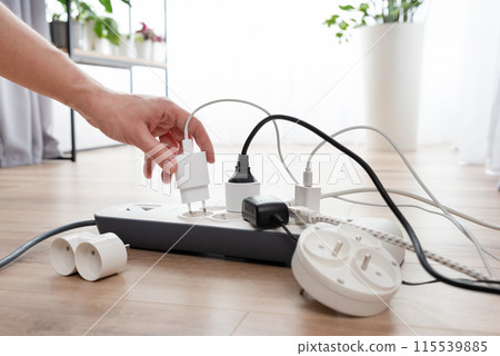 Power strip socket with connected plugs. 115539885