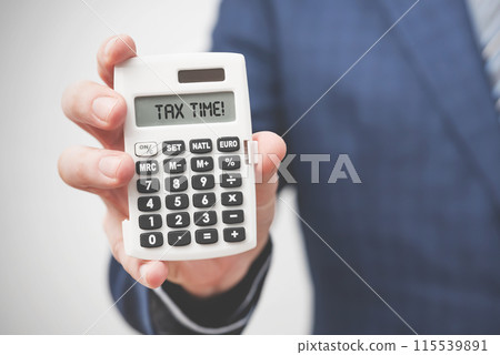 Businessman holding calculator. Tax concept 115539891