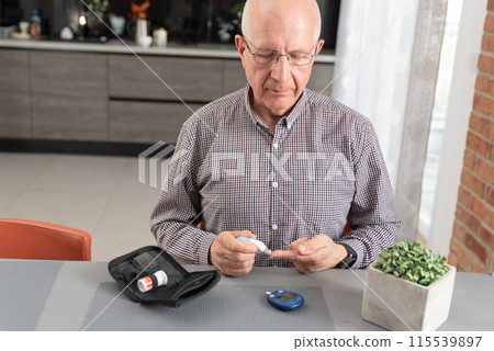 Man measures his blood sugar. Diabetes concept 115539897