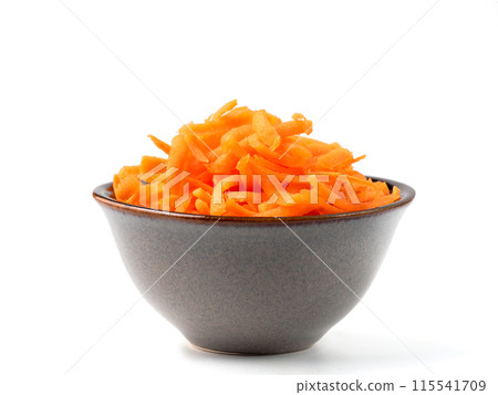 Fresh organic shredded carrots in small white bowl. Raw grated carrots isolated on white with clipping path. Fresh organic shredded carrots in small white bowl. Raw grated carrots isolated on white with clipping path. 115541709