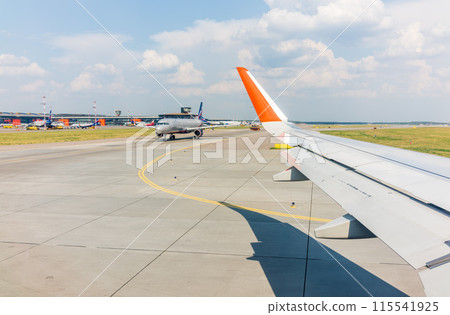 View from the airplane window during takeoff at Sheremetyevo airport at summer View from the airplane window during takeoff at Sheremetyevo airport at summer 115541925