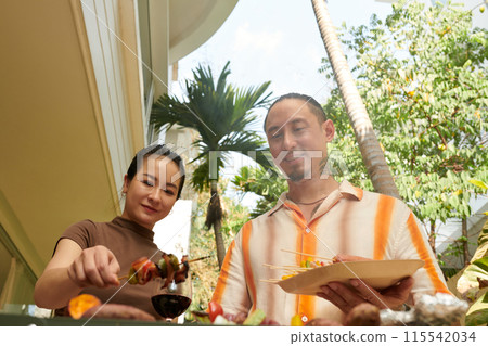 Cooking Kebabs for Dinner Cooking Kebabs for Dinner 115542034