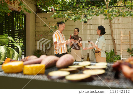 People Having Wine and BBQ 115542112