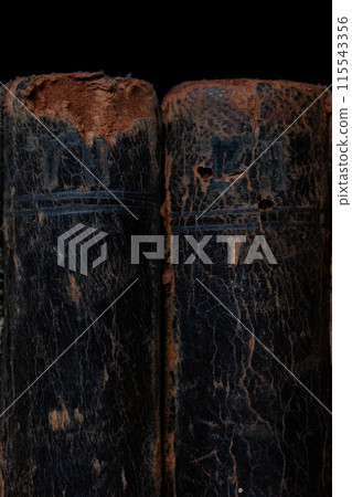 Old vintage books on black background Old vintage books on black background 115543356