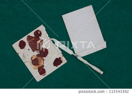 Retro envelope opener knife with magnifying glass and vintage letter envelope 115543392