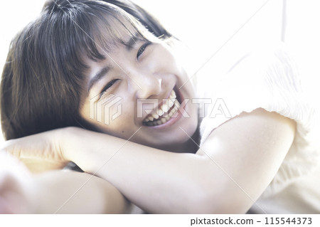 A woman surrounded by gentle light A woman surrounded by gentle light 115544373