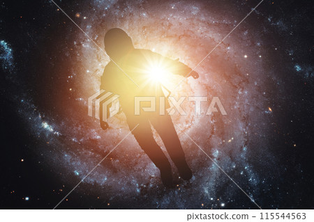 Silhouette of an astronaut in space against the background of the galaxy. Elements of this image furnished by NASA Silhouette of an astronaut in space against the background of the galaxy. Elements of this image furnished by NASA 115544563